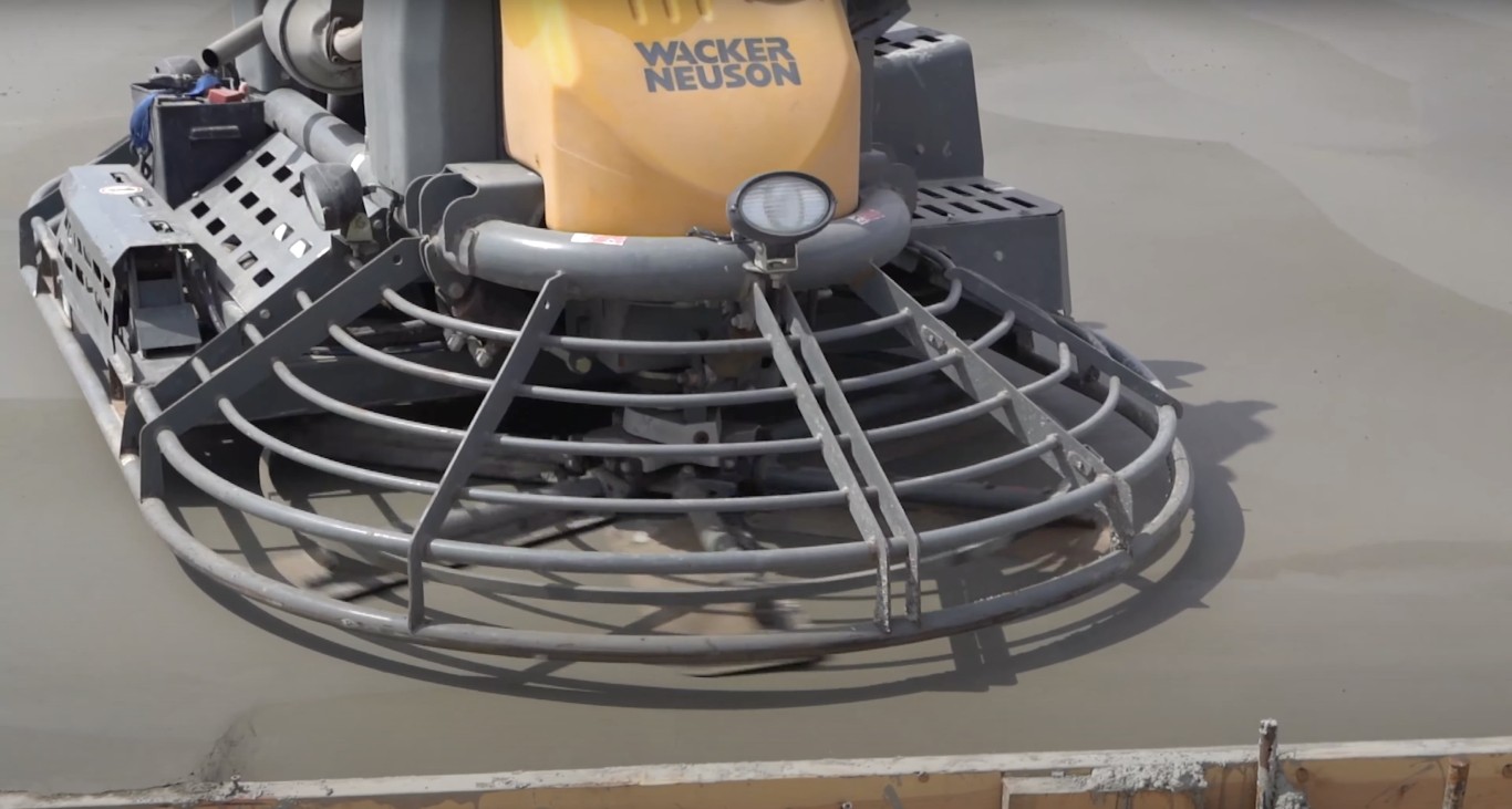 Professional concrete finishing with power trowel in Milford, CT